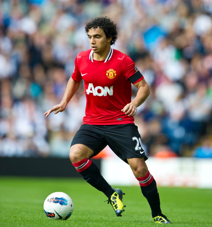 a man in a red aon jersey runs with the ball