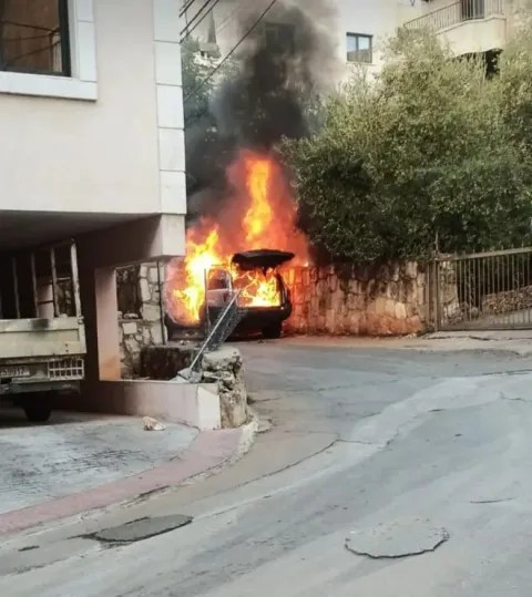 A car on fire in the capital after a blast in capital