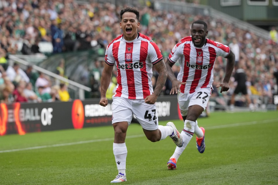 two soccer players wearing bet365 jerseys are running on the field