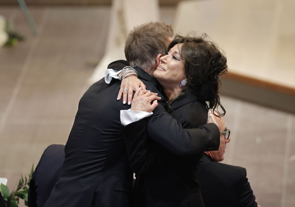 Nancy Dell'Olio and David Beckham greeted each other with a warm embrace