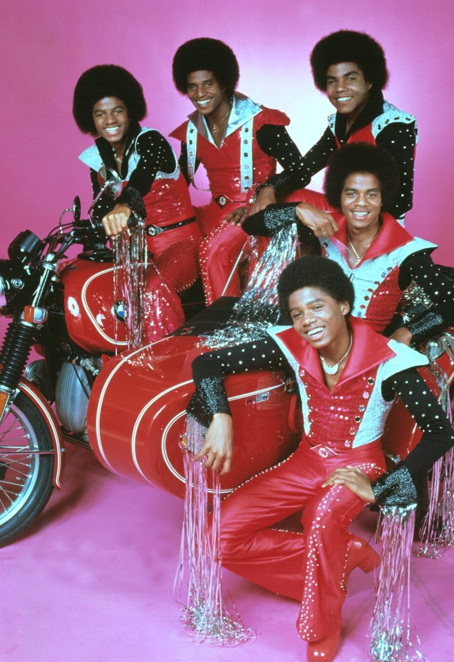 a photo of the jacksons with motorcycles and scooters