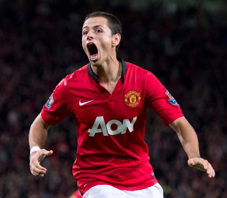 a man in a red aon jersey celebrates a goal