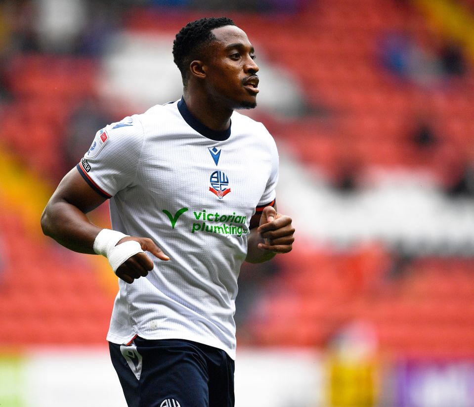 a soccer player wearing a white shirt that says victorian plumbing