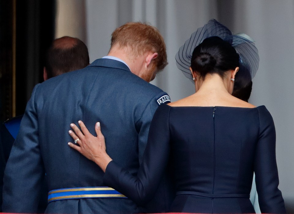 Judi observed how Meghan often touches Harry's back