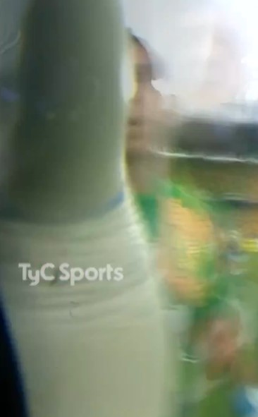 a blurry picture of a person standing in a room with the words tyc sports written on the bottom .