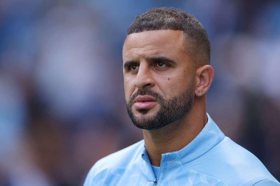 a man with a beard is wearing a light blue jacket