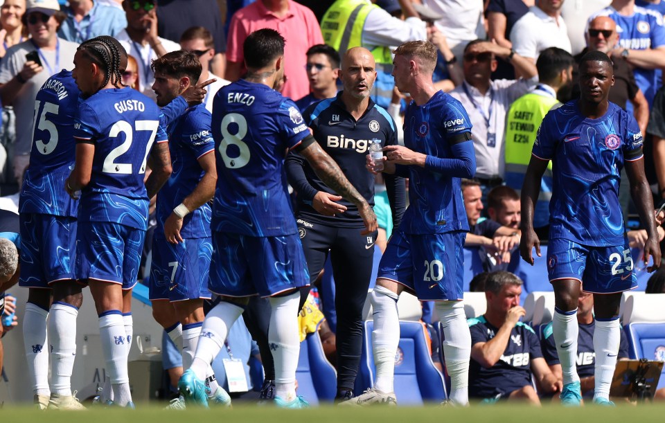 a group of soccer players wearing blue jerseys with the word bing on them