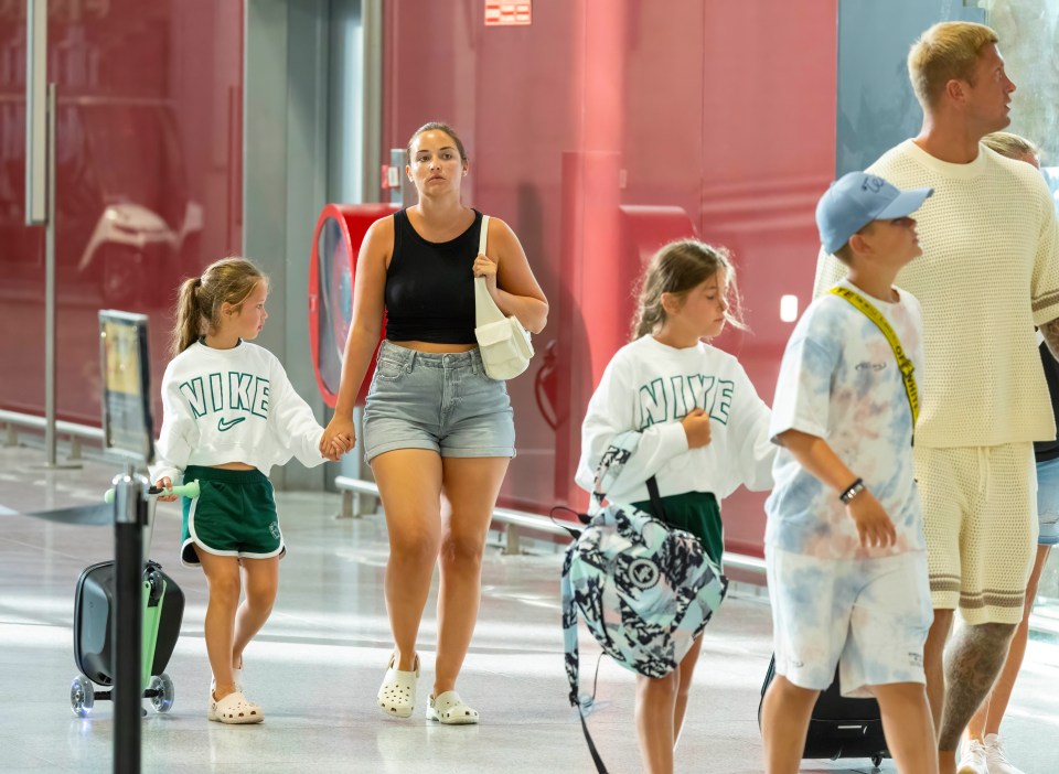 Jacqueline Jossa, Dan Osborne and their children fly out of Malaga days after being robbed by a masked gang as they slept