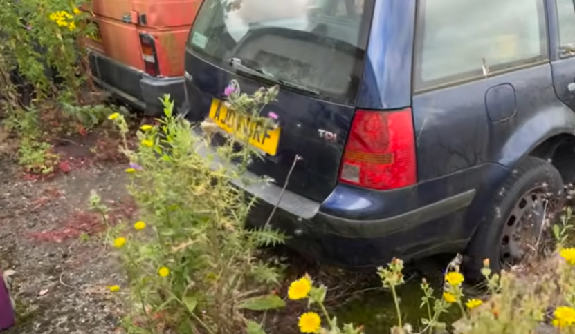 a blue car with a license plate that says l80 nrf