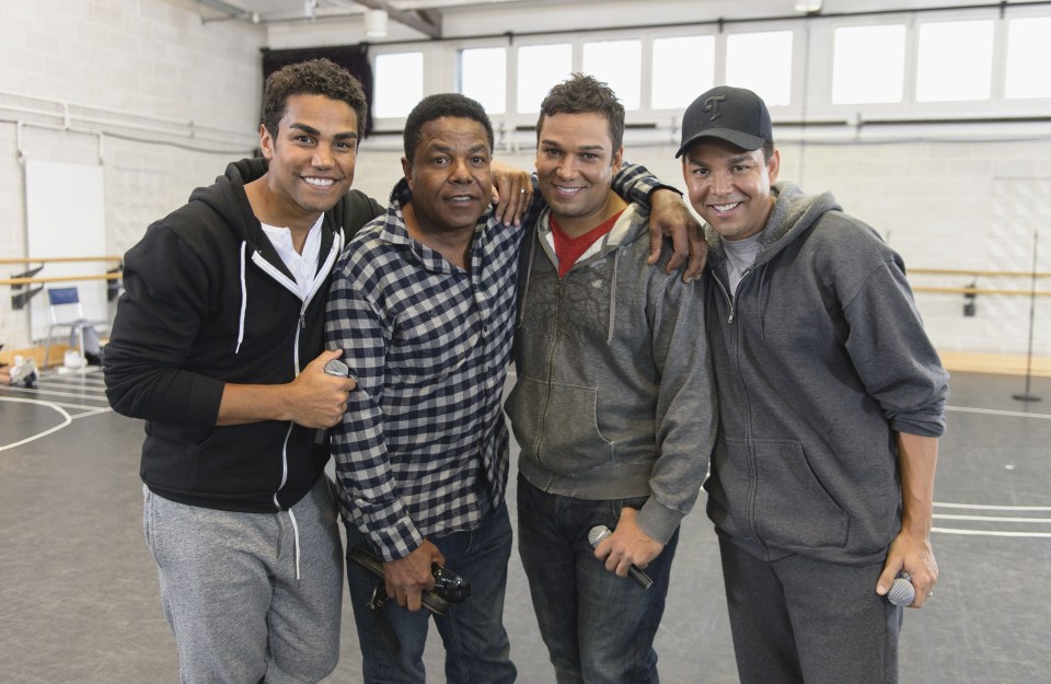 four men posing for a picture with a watermark that says ' shutterstock ' on it