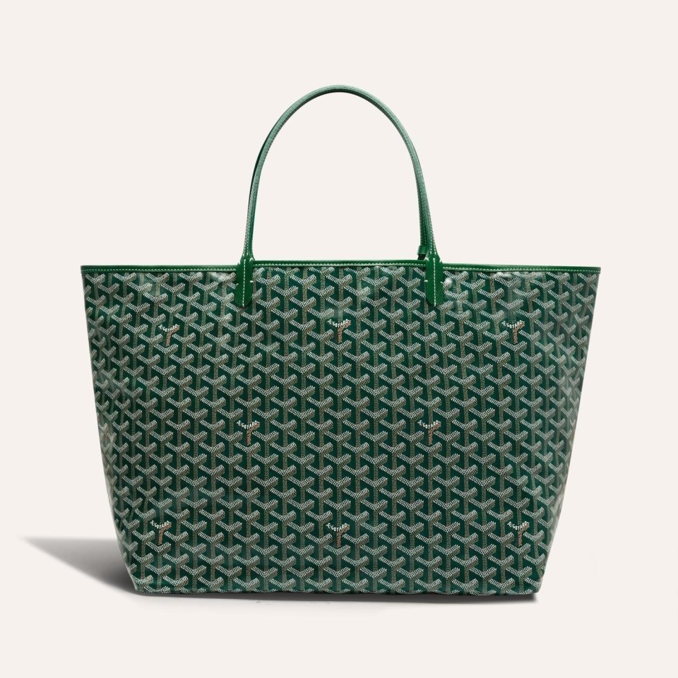 a green tote bag with a goyard pattern on it