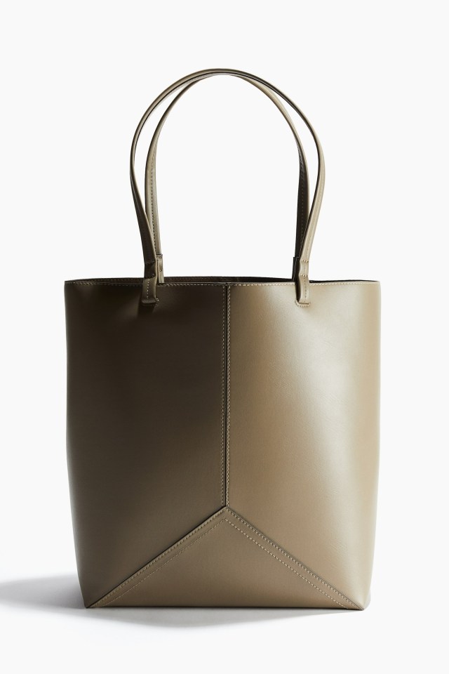 a brown leather tote bag with a geometric design