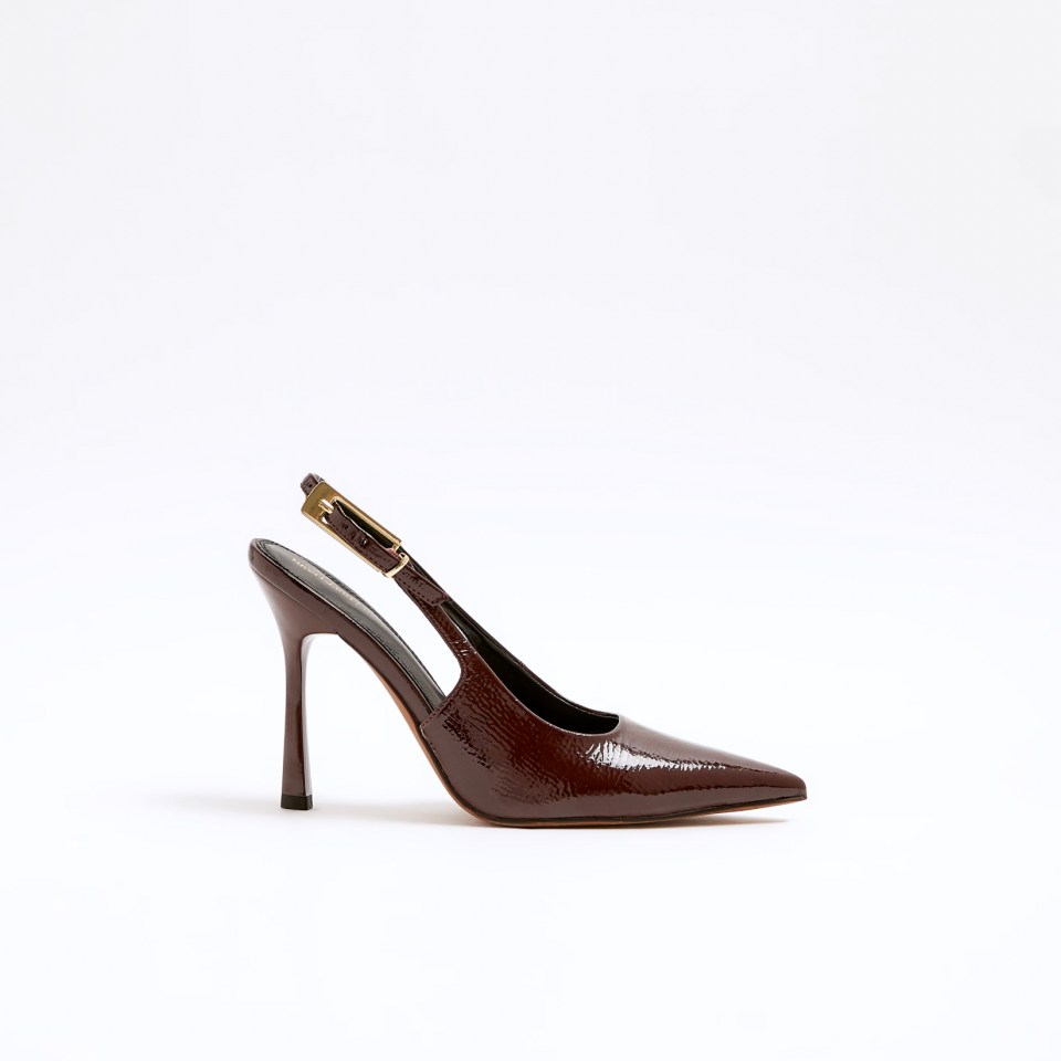 a pair of brown slingback shoes with a gold buckle