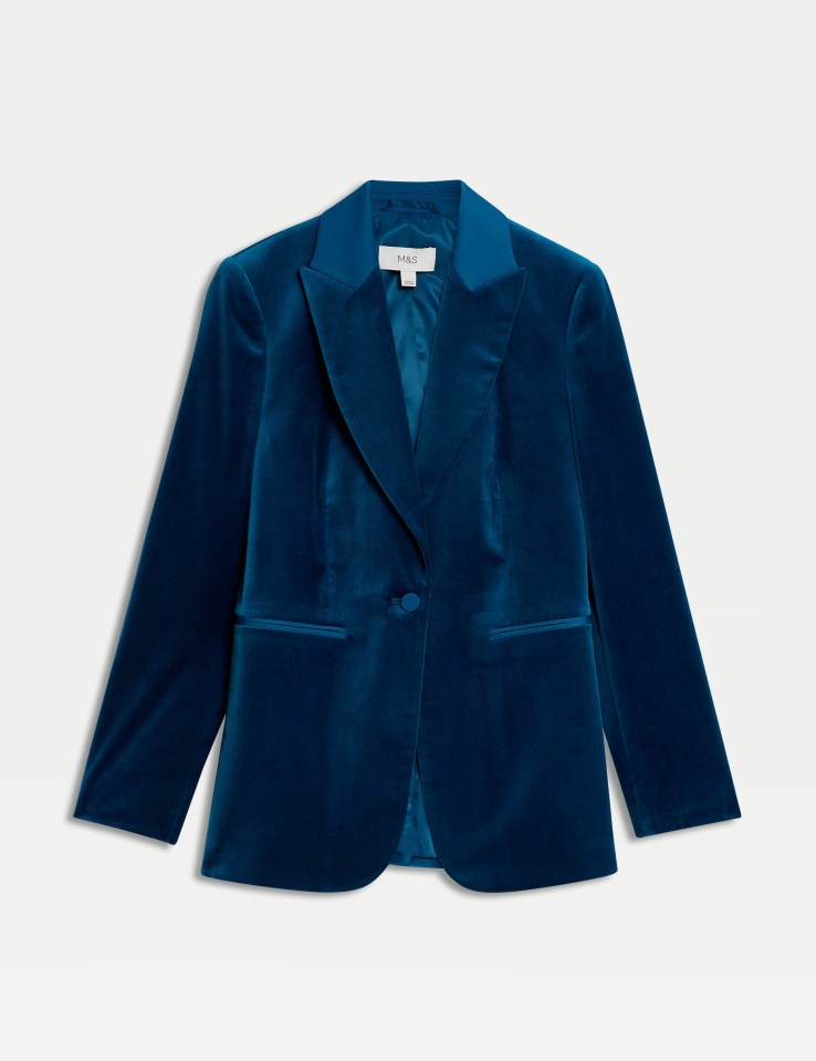 a blue velvet jacket with the word paris on the front