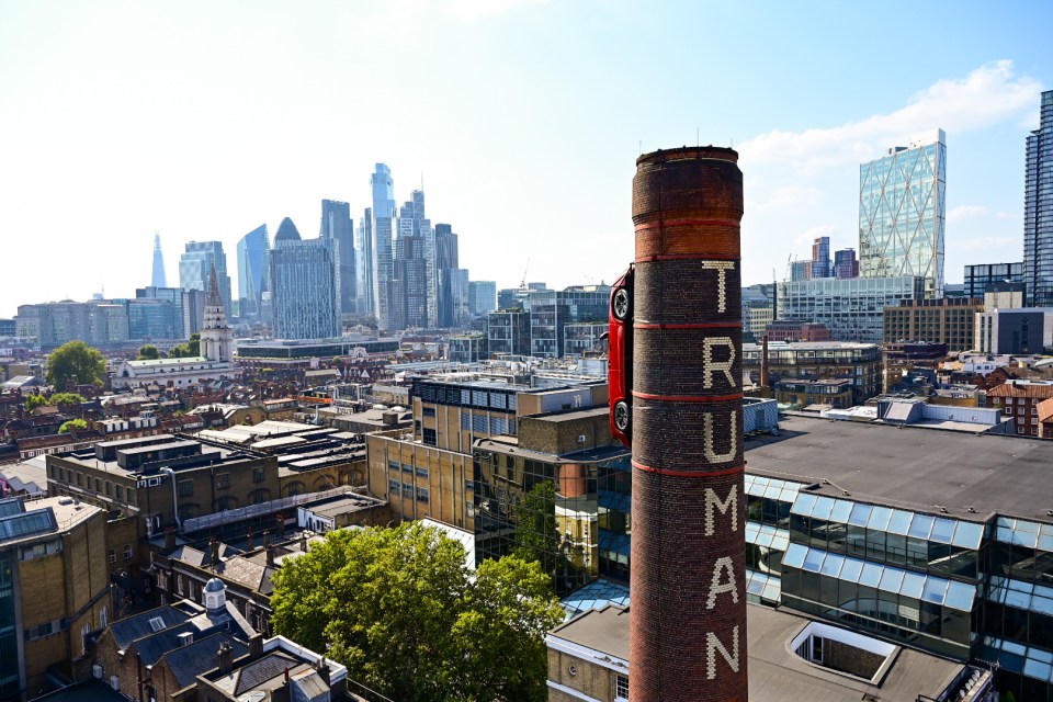 a brick chimney with the word triumph written on it