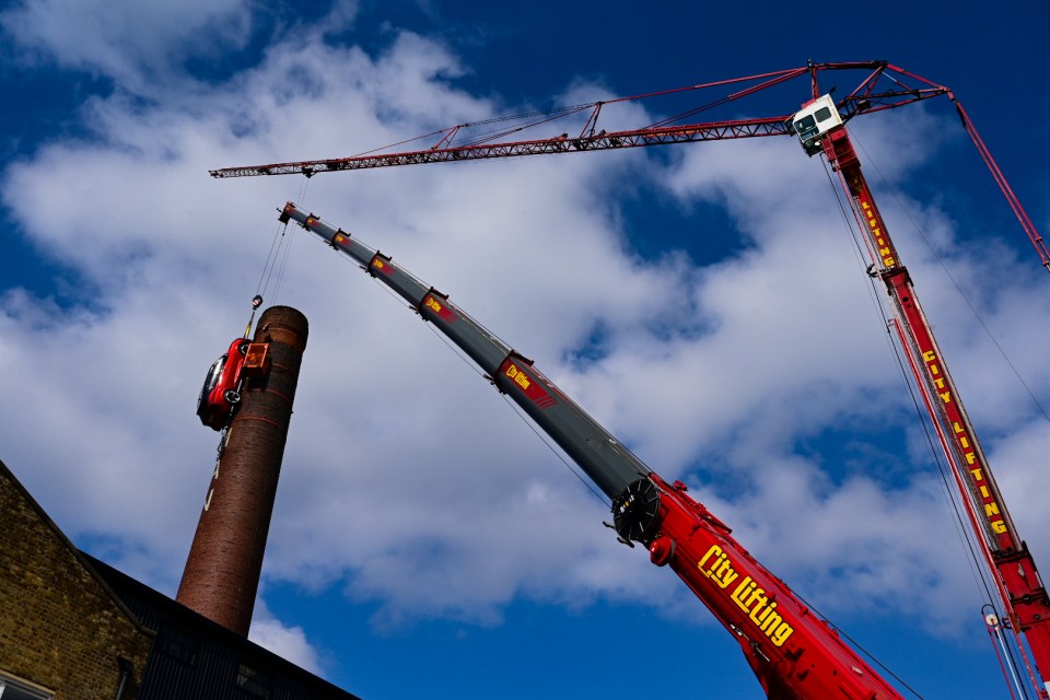 a red crane that says city lifting on it