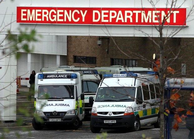 several ambulances are parked in front of the emergency department