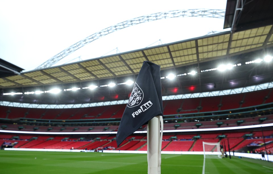 a soccer field with a flag that says for it on it