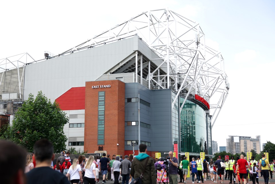 a crowd of people are gathered outside of east stand