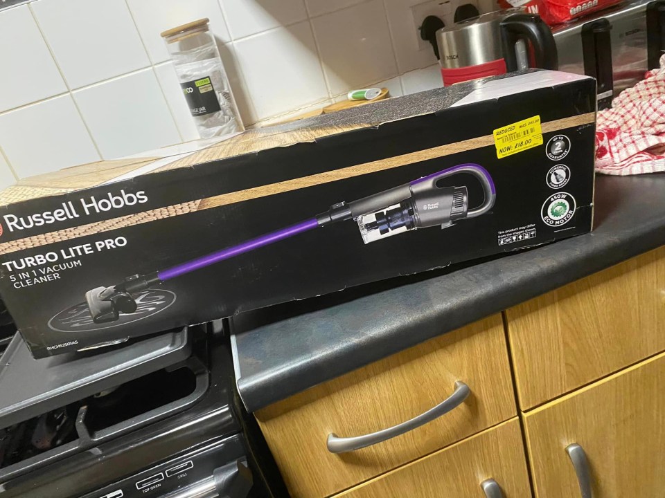 a russell hobbs turbo lite pro vacuum cleaner sits on a kitchen counter