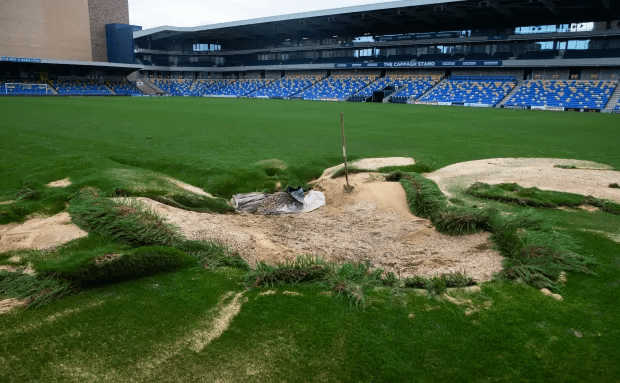 a soccer field with a sign that says the cardiff stadium