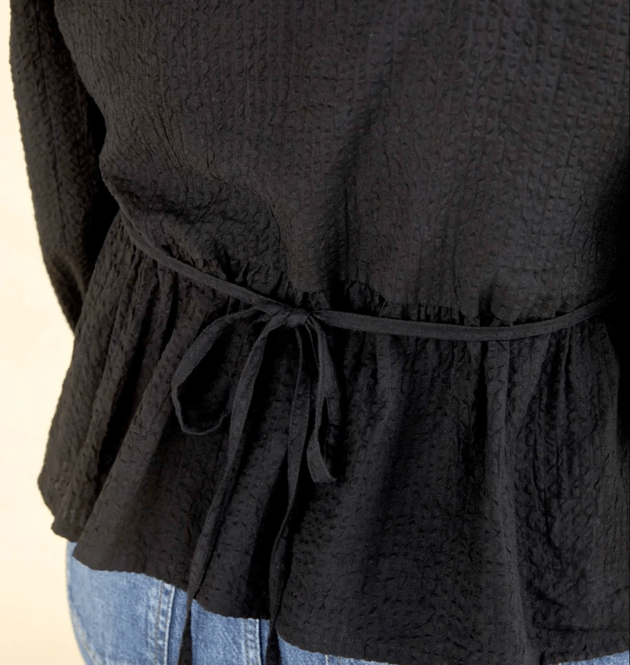 The 'Sarah' blouse also features a tie-back detail so you can adjust the fit