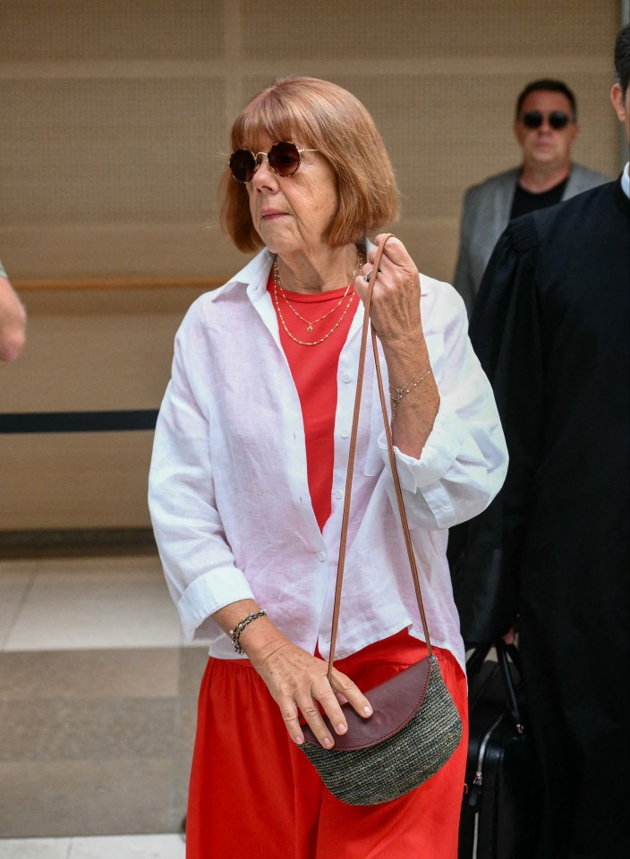 an older woman wearing sunglasses and a red dress