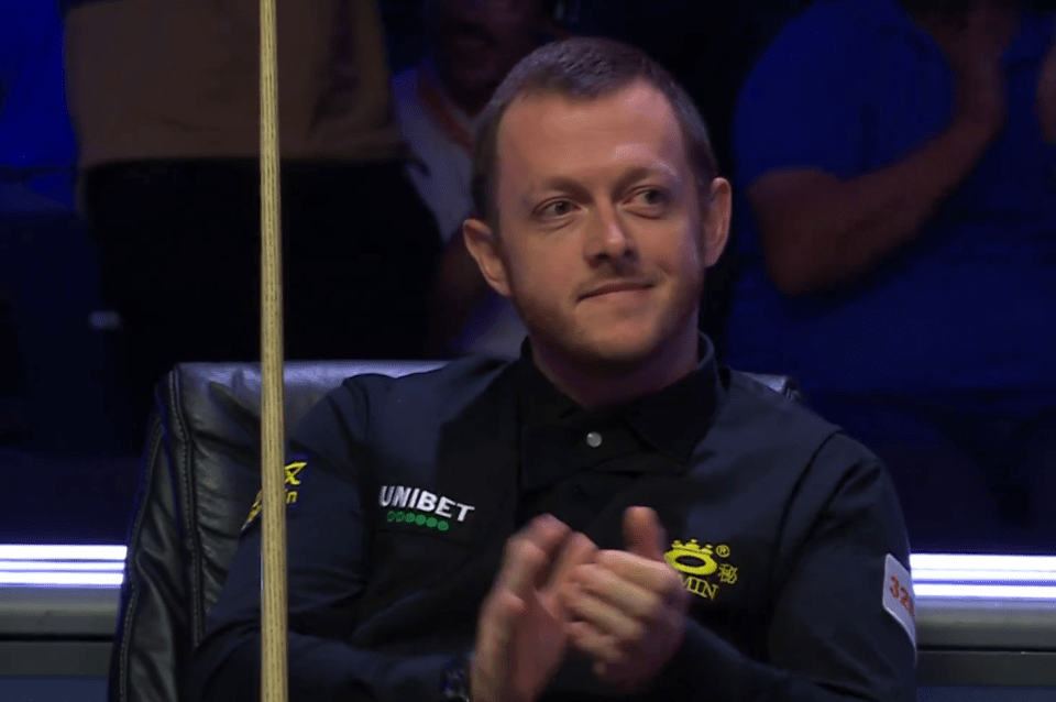 a man in a black shirt with the word unibet on it