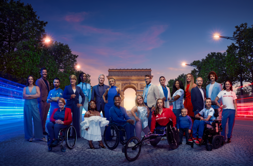 a group of people are posing for a picture and one of them is wearing a shirt that says " great britain "