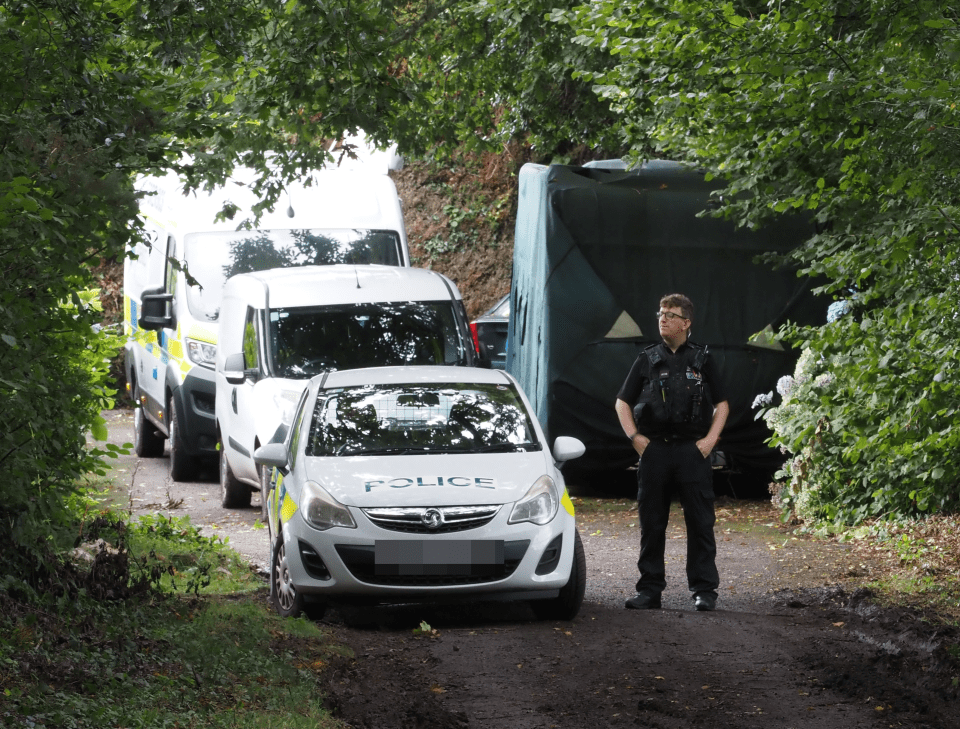 Police at the scene after Hudson and Tasmin died at a property in Cornwall