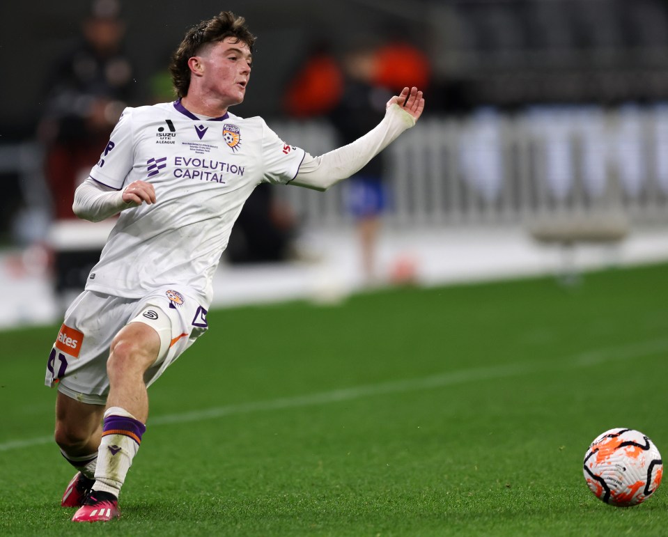 a soccer player wearing a jersey that says evolution capital