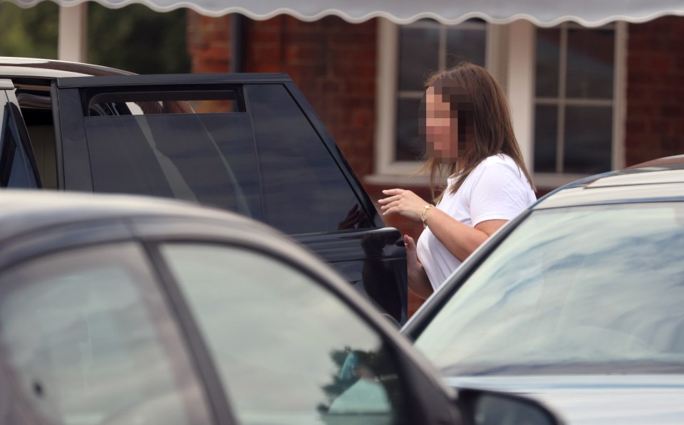 After greeting him in the front, the woman switched positions to sit in the back with Jermain