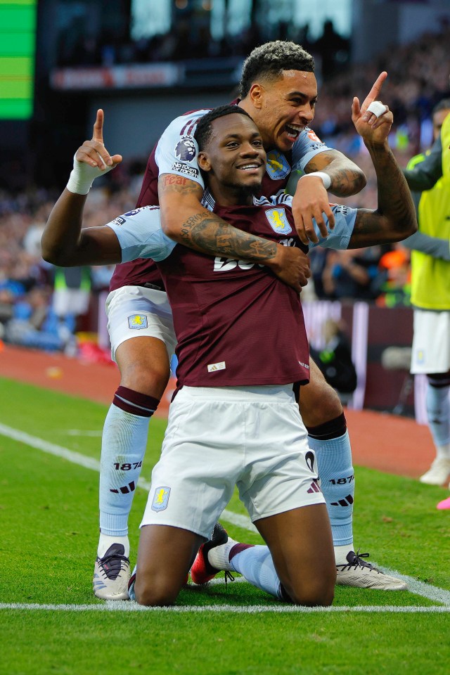 two soccer players are hugging each other and one has the number 18 on his shorts