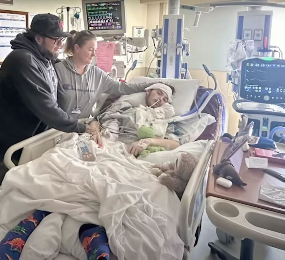 a person in a hospital bed with a champion shirt on