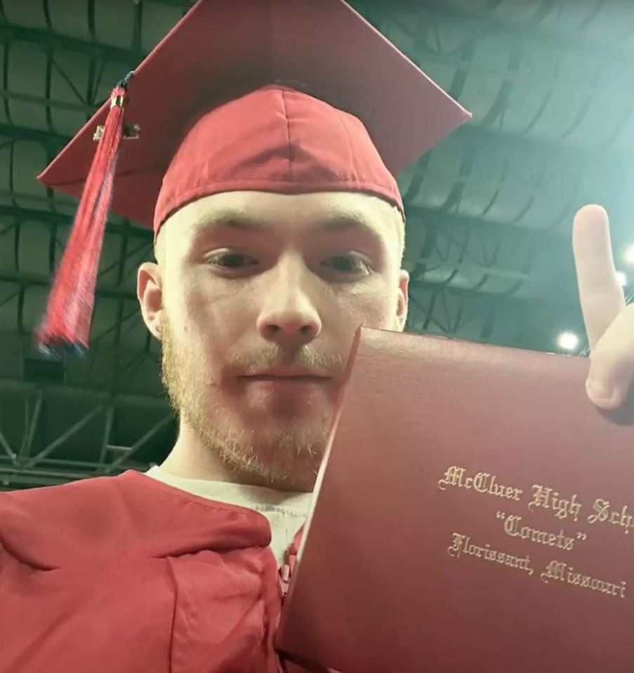 a man in a graduation cap and gown holds up a diploma from mcclear high school