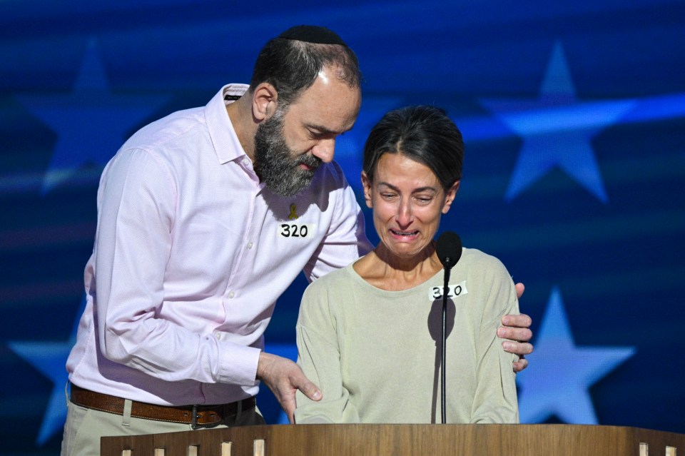 Jon Polin comforts his wife Rachel Goldberg at the Democratic National Convention as she speaks about their son Hersh, who was killed while being held hostage by Hamas