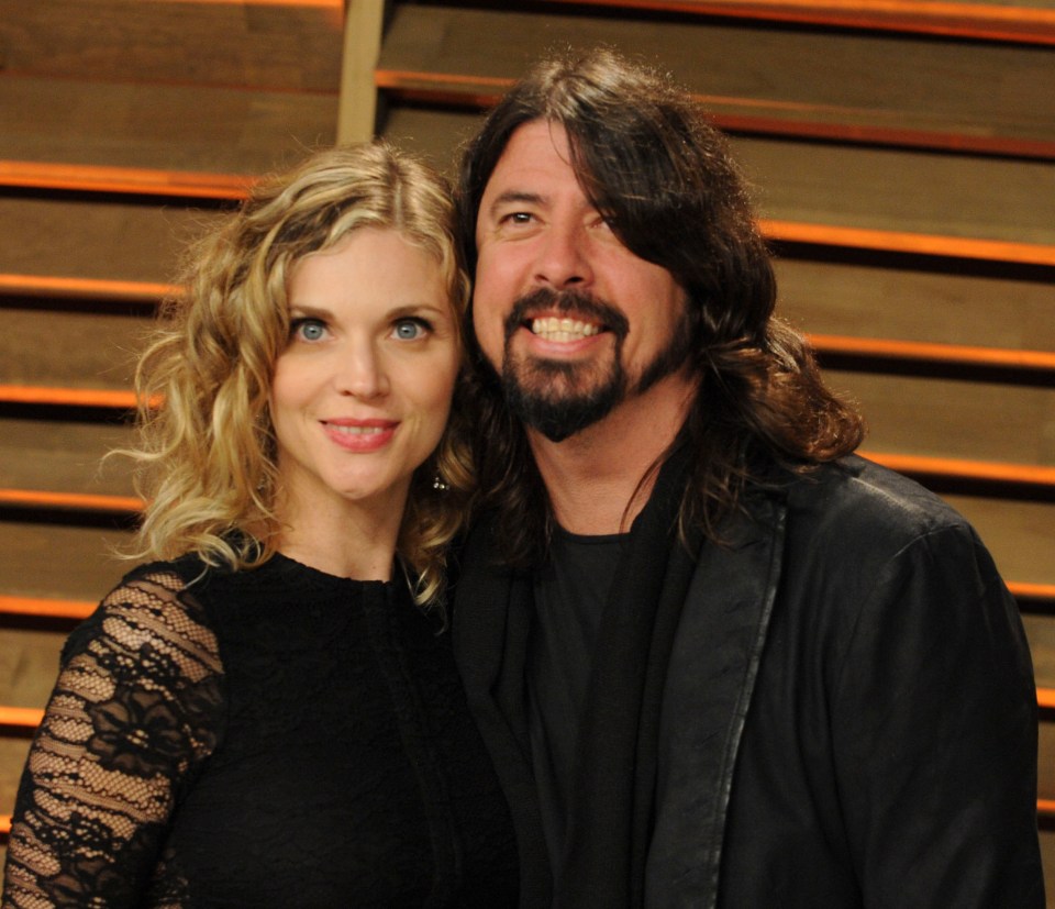 a man and a woman are posing for a picture together