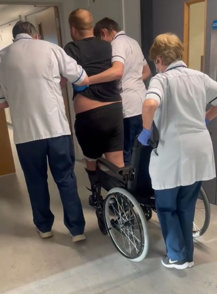 Hospital staff helping Connor, from Derbyshire, to walk