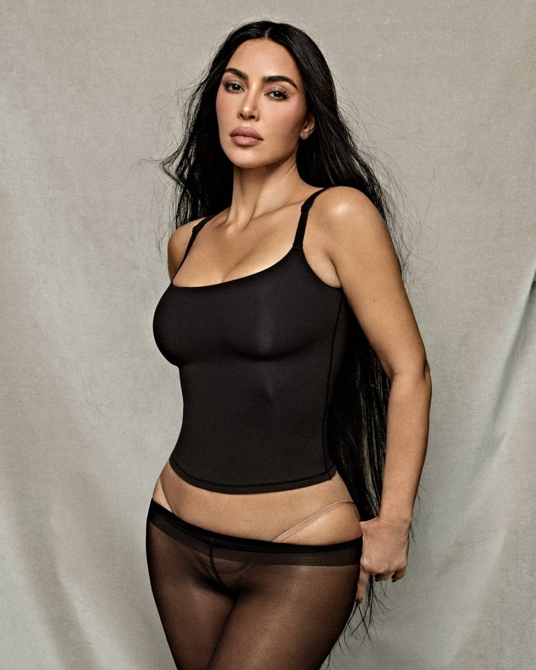 kim kardashian is wearing a black tank top and black tights