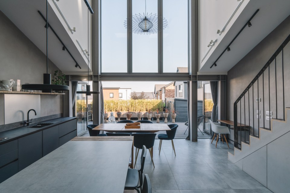 Pictured: The kitchen and dining area inside the bespoke home