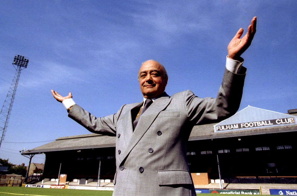 a man in a suit stands in front of the fulham football club