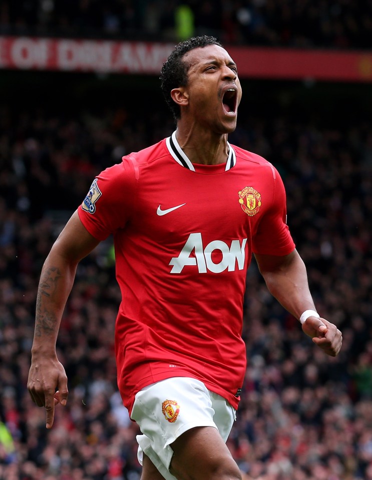 a man in a red aon jersey celebrates a goal