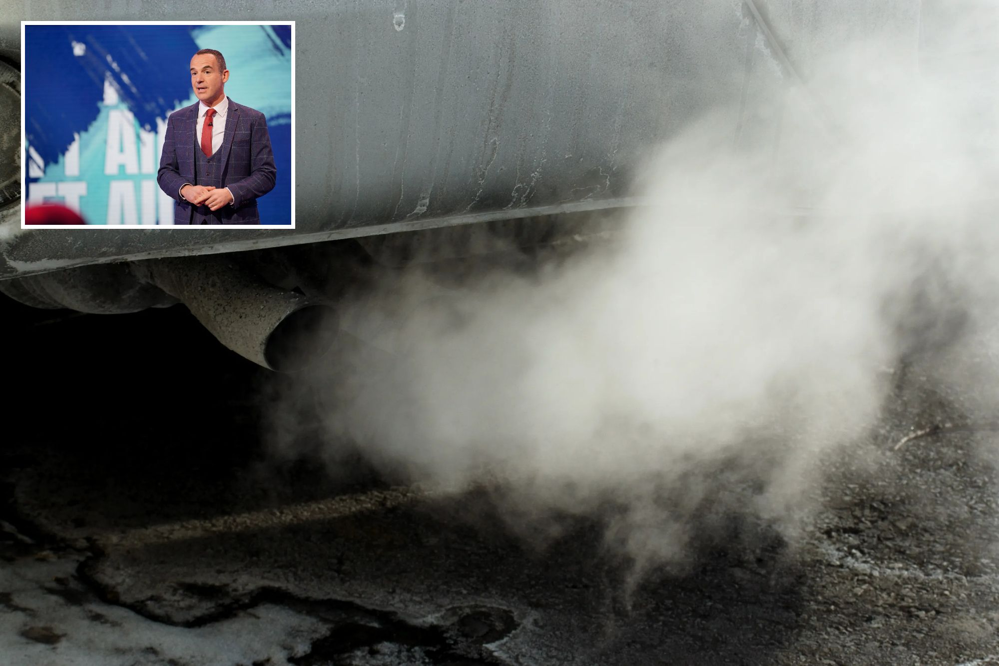 a man in a suit and tie is standing next to a car with smoke coming out of it