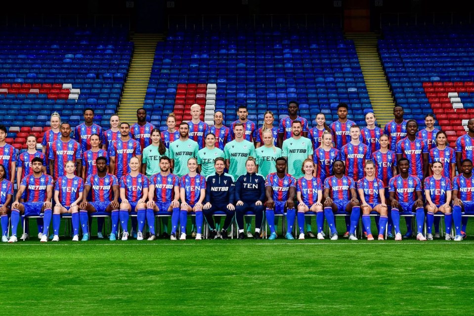 a group of soccer players wearing netbet jerseys pose for a team photo