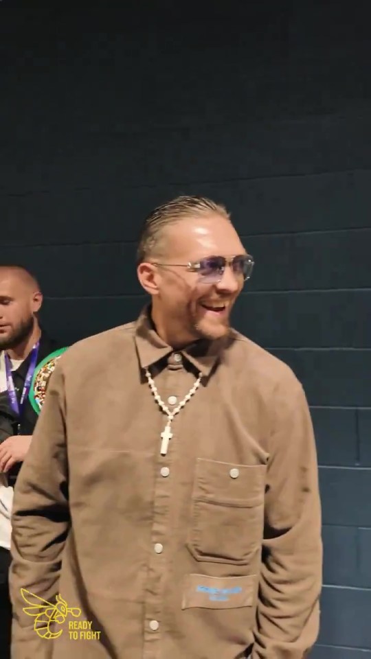 a man wearing sunglasses and a shirt that says " ready to fight "