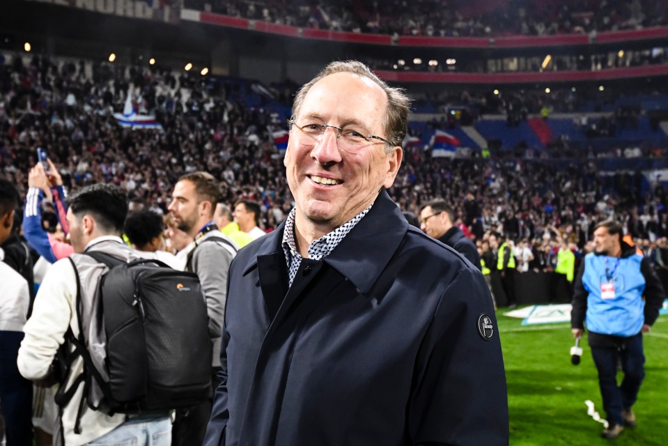 a man in a blue jacket with a badge that says ' a ' on it