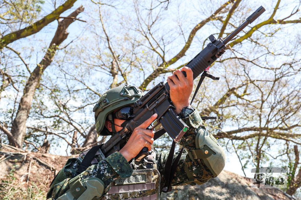 A Taiwanese soldier aiming an assault rifle during an anti-drone exercise