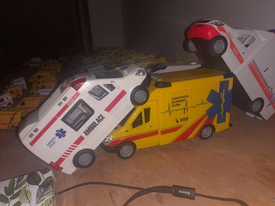 a toy ambulance with the number 155 on it