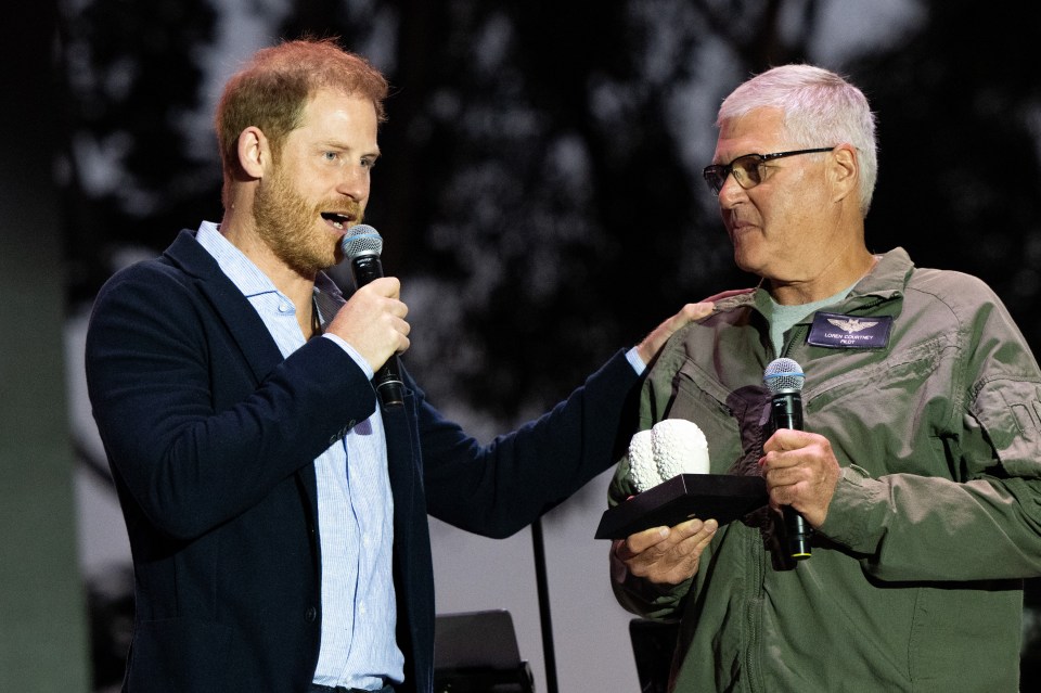 He presented an award to helicopter pilot Loren Courtney yesterday