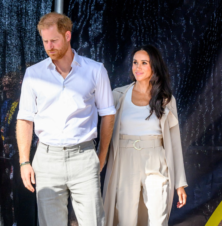 a man and a woman standing next to each other